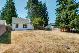 Mostly level grass in front and back, one has a "clean slate to realize the potential of this property!