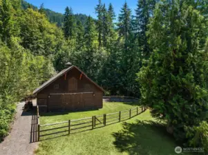 3 stall capacity Barn Pros Barn with Wood rail fenced paddock area off stalls & Tack area with stairwell to full length loft