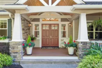 Large covered porch with double doors and Trex decking welcomes you to the home.