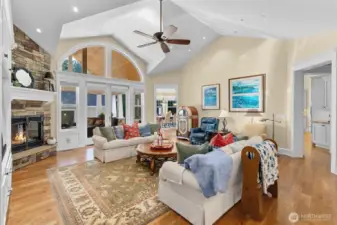 French doors lead out to covered patio, and doorways go to the kitchen.