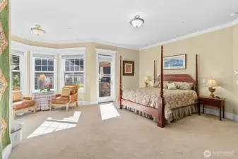 Primary suite with plenty of space also has access out to patio and water feature.