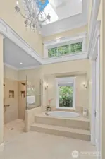 Amazing primary bathroom with high ceilings, chandelier, and skylights.  Heated floors!