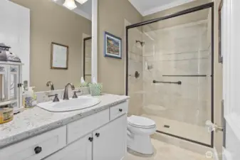 Hallway bathroom with tile floors.
