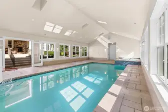 Pool is 35' x 16' and varies in depth from 4' to 8'.  French doors and windows all around pool can open to let air in.  Automatic pool cover and dehumidifier already in place.