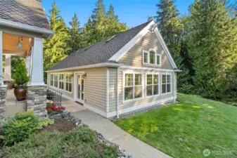 Photo of the exterior of the pool house showing the beautiful surroundings.