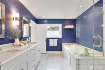 Primary bathroom with soaking tub and walk in shower.