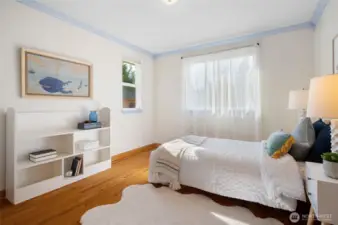 Additional sunlit bedroom.