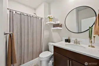 Main floor full bath just off the main floor bedroom.  GREAT MULTI-Gen opportunity