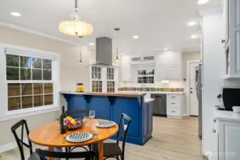 Eat-in kitchen options include table or stools at the solid wood bar