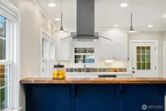 Beautiful design elements separate dining and kitchen