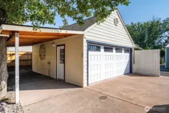 Newer garage with alley access and attached carport