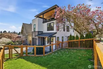 Fully fenced front yard with curb appeal