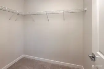 Large walk-in closet. Photos of a different unit. Differences in finishes may apply.