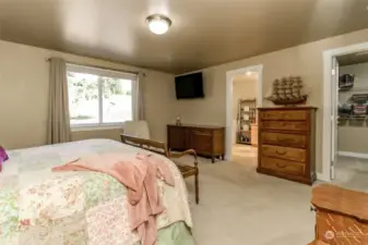 Primary bedroom looking toward walk in closet and bathroom