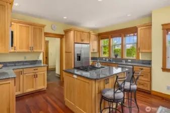 Generous amount of well built cabinets and yards of counterspace in this chefs kitchen.