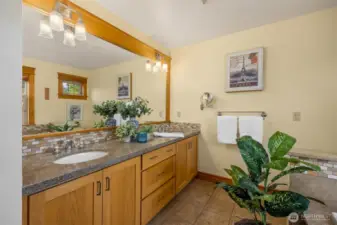 Primary bathroom. Large tub and separate shower behind photographer.