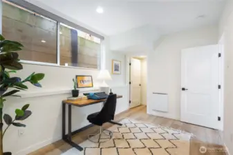 The second bedroom on the first level is currently staged as an office.