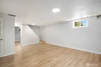 Lower level receoom/living room. New metal railings are on there way and will be installed prior to closing.