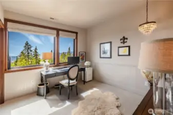 upper floor bedroom is nicely appointed to take in views.