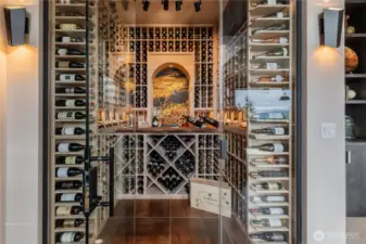 Custom built temp controlled 700+ bottle wine room sets the scene for a perfect evening in with guests or not.