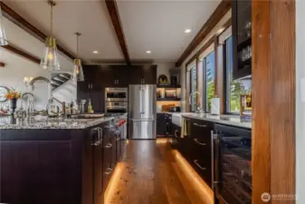 Kitchen is fully equipped all the way down to a handy wine fridge with high end Wolfe, Thermador, Bosch, and LG appliances