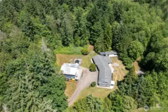 This property truly has it all—Spacious Rambler, ADU, Shop, and Over 5 Secluded Acres in a Sought-After Location!
