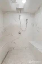 Rejuvenating walk-in floor to ceiling tiled shower.