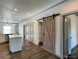 Open Design and Doors to the Patio, Primary   Bedroom, Pantry, Laundry and 2nd Bedroom   to the right