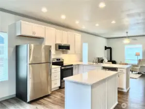 Inside you are greeted by an open concept design where the kitchen, dining and living room flow seamlessly.
