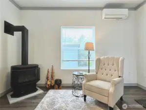 Classic Coastal Living Room with Propane Burning Stove, wall heaters and Mini-Split Heat / AC for ultimate comfort