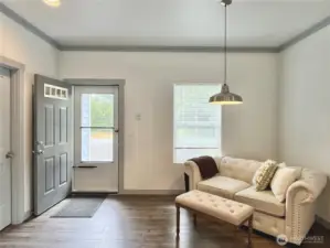Elegantly painted Trim, doors compliment laminate flooring throughout