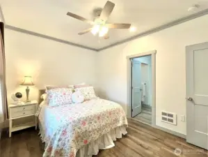 View of Primary Suite and door to the full bathroom and walk in closet.