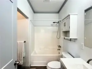 Primary Bedroom Bathroom with Soaking Tub and access to walk-in clostet