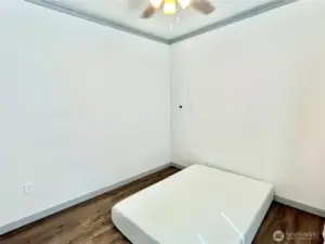 Bedroom #2 is also a very spacious room. This photo taken with a queen-sized mattress set for photos. Room is now being used as a staging area for tenant's boxes and moving supplies.