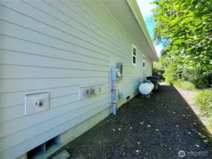 View of the North side of the home. Propane and convenient utiltiy connections here.