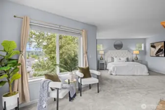 main suite with fireplace and sitting area