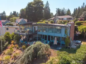 Covered and open deck area upstairs with  huge covered and open patio areas with hot tub and sauna on the lower level