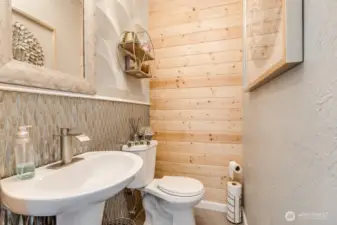 Delightful Powder room with many textures on the main floor