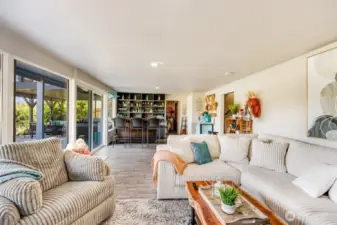 Family room looking South towards bar and outside patio areas