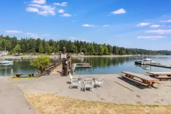 Community beach with picnic area, dock and floats for moorage