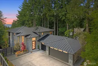 Complemented by a 924 SF three-car garage with heated floors, skylights, and versatile flex space—engineered for future expansion with full-stack plumbing and structural beams already in place.