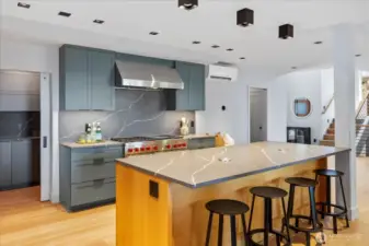 Designer lighting, custom cabinetry, quartz countertops, and artisanal tile work