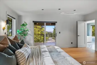 Primary bedroom retreat has its own covered & heated balcony
