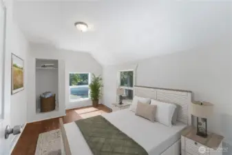 Large windows bathe this room in daylight, highlighting its warm floors and clean lines. True to the spirit of this 1910 home, it offers timeless simplicity while providing space for comfort and personalization. Look at all of the incredible accents you don't see more modern homes.