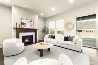 Cozy up by the gas fireplace in this stylish, open-concept living area.