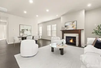 Cozy up by the gas fireplace in this stylish, open-concept living area.