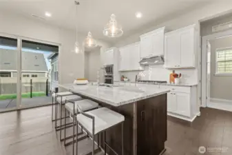 Stunning countertops and custom soft-close cabinetry offer both beauty and function.