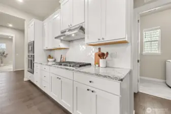 Every detail has been upgraded — hardwood, lighting, and soft-close everything.