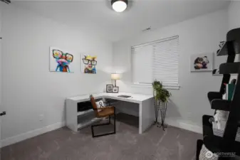 Bedroom 2 with french doors and walk in closet.