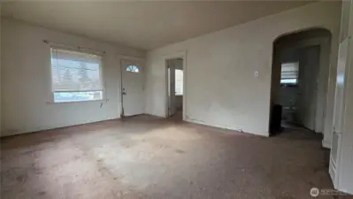 Extra large living room has two large windows letting tons of natural light in